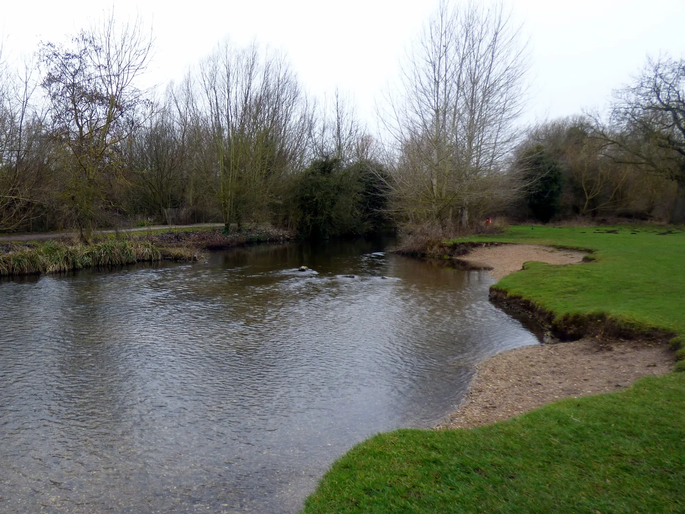 The River Lea where it runs through Stanborough Park, photographed in February 2018. The repair covers the bank and footpath beside the underpass, not the stretch shown here